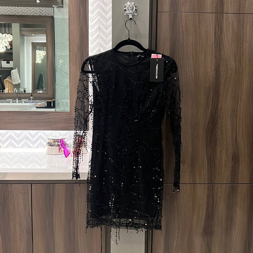 Pretty Little Thing black dress runs small. NWT